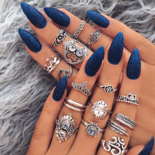 Blue glitter on the nails